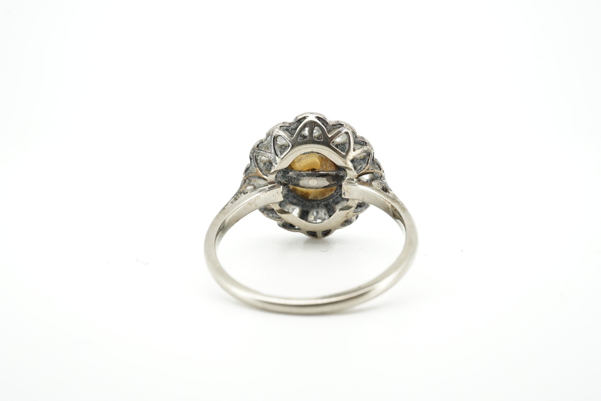 An 18ct and plat. cultured pearl and diamond set circular cluster ring, size O, gross weight 3.5 grams. Condition - fair